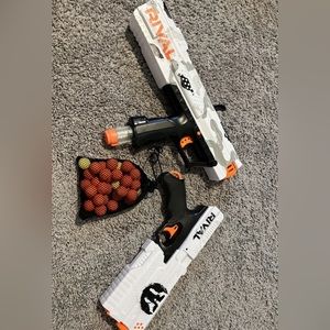 2 Nerf guns with ball bag.
